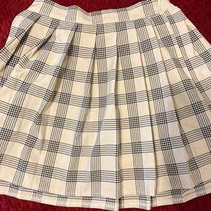 Checkered beige and black pleated skirt
